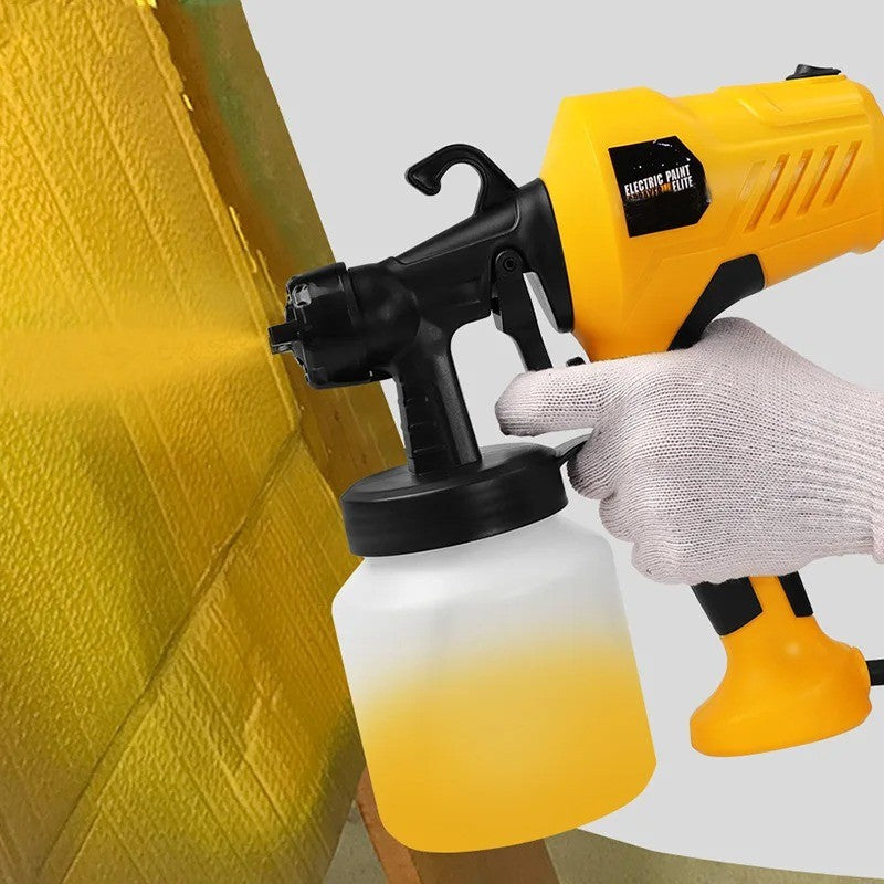 Pintando una pared con la pistola de pintura eléctrica